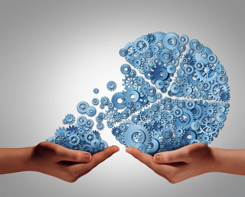 A pie-shaped image made up of blue digital gears divided into four sections with one section pouring into a hand