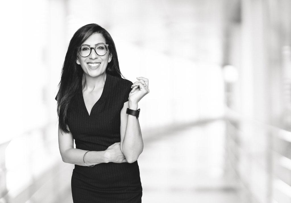 President and CEO Kal K. Sahota smiling for a headshot taken in black and white